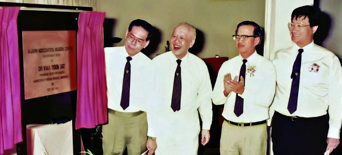 Unveiling of the stone plaque marking the official opening of the Alumni Association Medical Centre in 1990